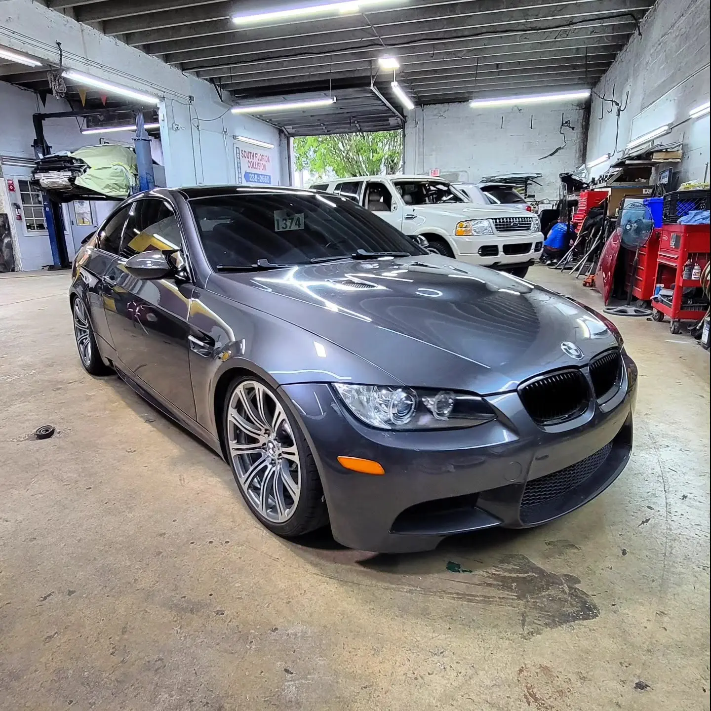 Grey BMW M3 in the repair bay at Marlin Motors in Cutler Bay, FL