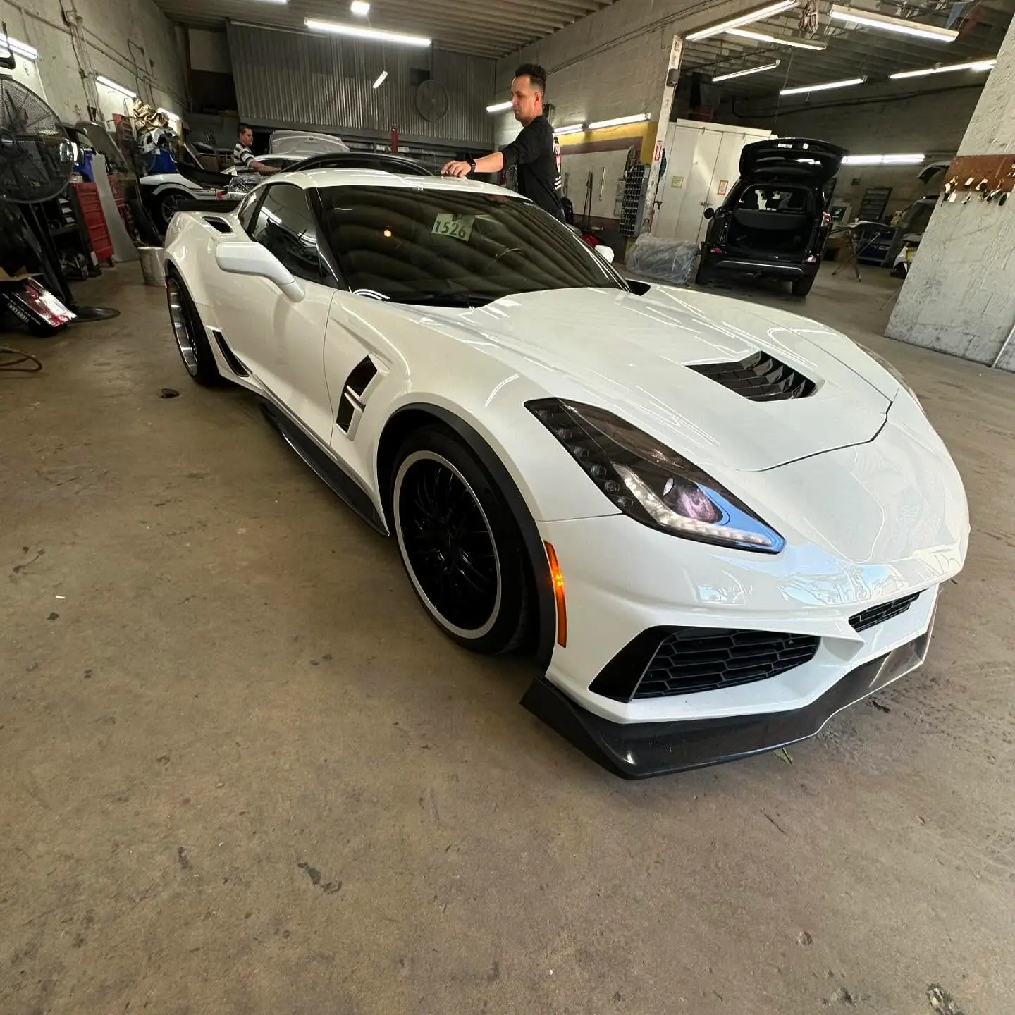 White Chevrolet Corvette ZR1 inside the Marlin Motors body shop in Cutler Bay, FL