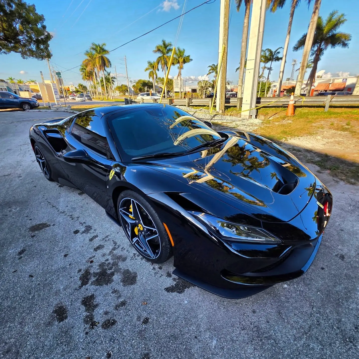 Black Ferrari with custom paint finished at Marlin Motors auto body shop in Cutler Bay, FL
