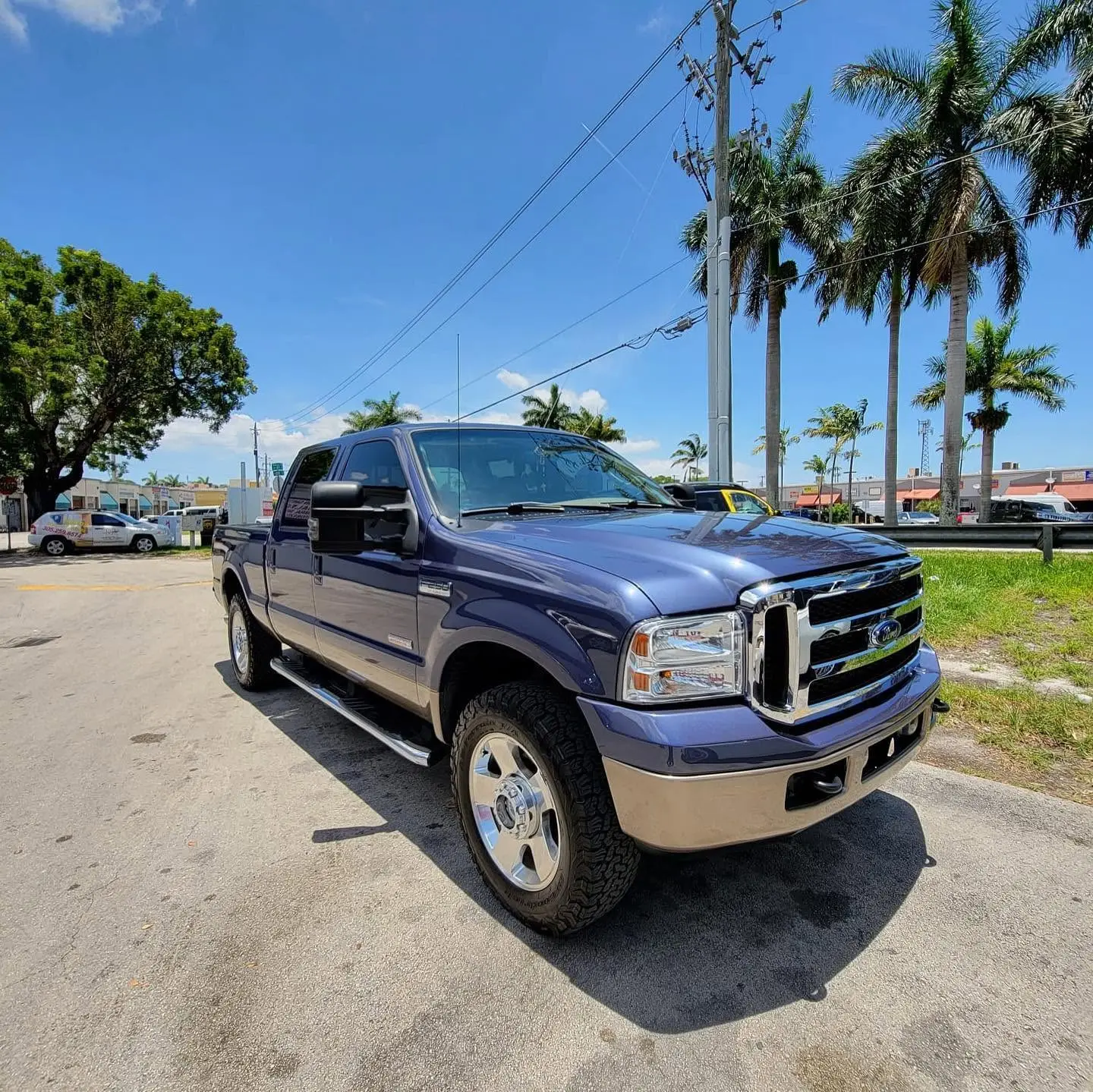 Blue and tan Ford F-250 Super Duty crew cab after bodywork at Marlin Motors in Cutler Bay, FL